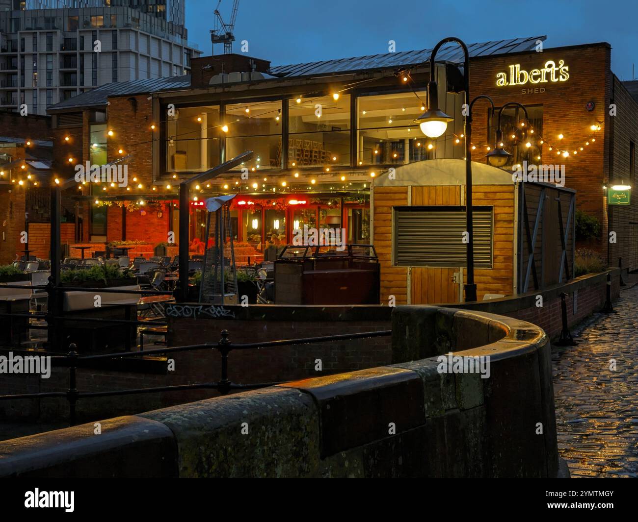 Albert's Shed restaurant, Castlefield. Wet cobbles on a rainy evening. Manchester UK - Smartphone Captured Stock Image Albert's Shed restaurant, Castlefield. Wet cobbles on a rainy evening. Manchester UK - Smartphone Captured Stock Image
