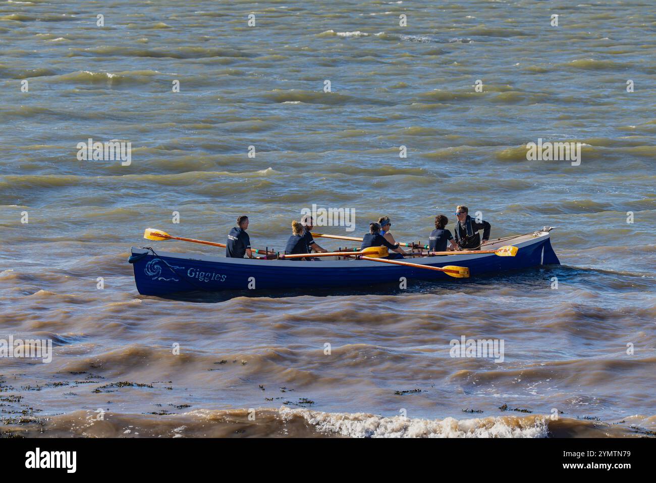 Pilot Gig racing on the Severn Estuary with choppy seas Stock Photo - Alamy
