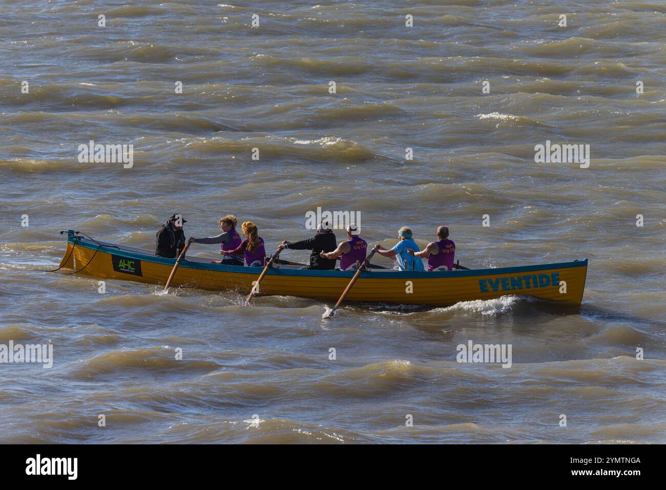 Pilot gig racing on the Severn Estuary with rough seas Stock Photo - Alamy