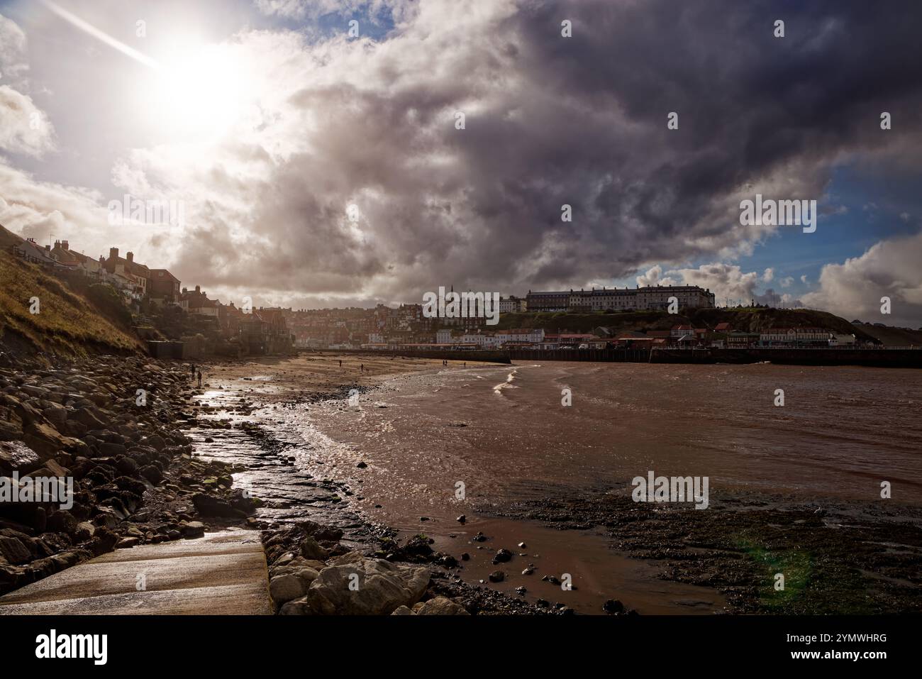 Whitby Sun Sun breaks through cloud over the Outer Harbour, Whitby, England Stock ...