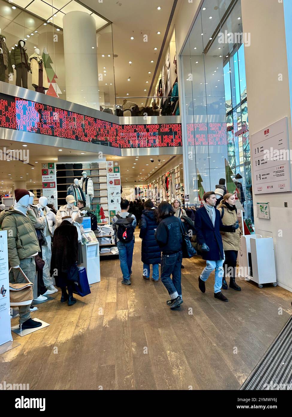 The entrance area of the UNIQLO store on the Kurfürstendamm in Berlin, Germany - Smartphone Captured Stock Image