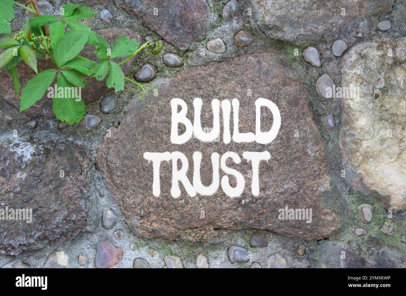 Build trust symbol. Stone wall with words Build trust. Beautiful stone ...