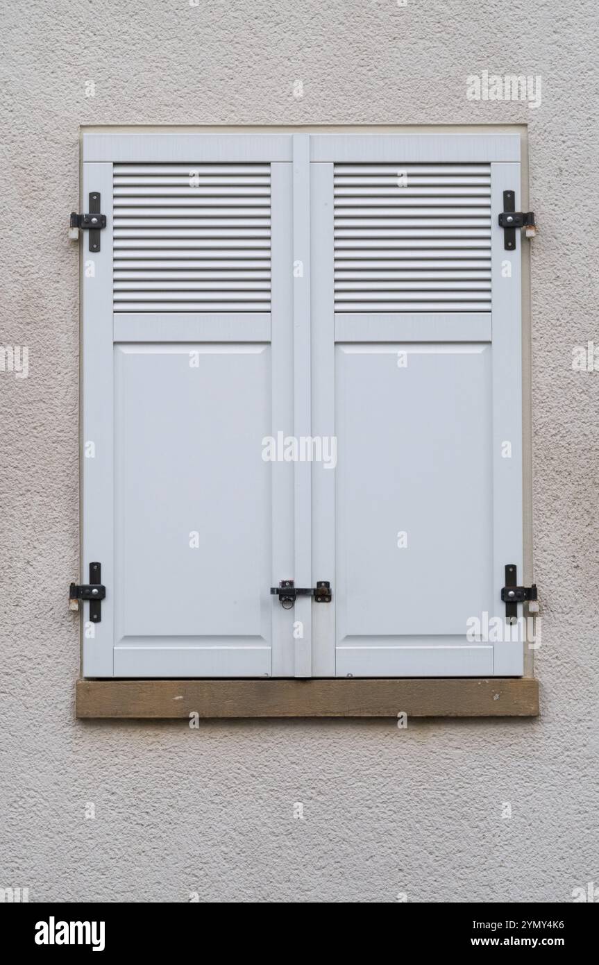 Windows with grey metal shutters Stock Photo