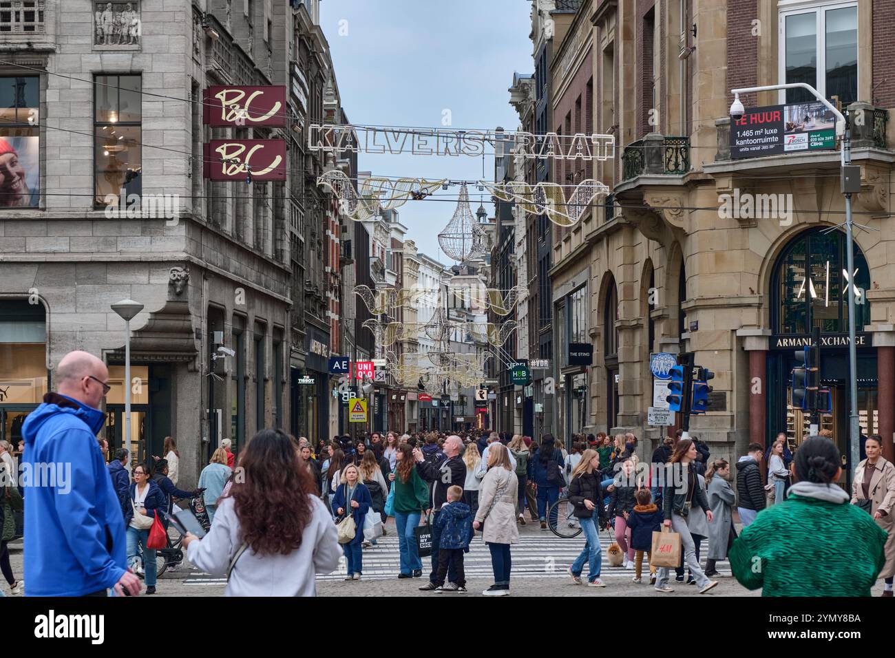 The Kalverstraat  is a pedestrianized shopping street in Amsterdam city centre. There are over 150 shops & is very popular. Stock Photo