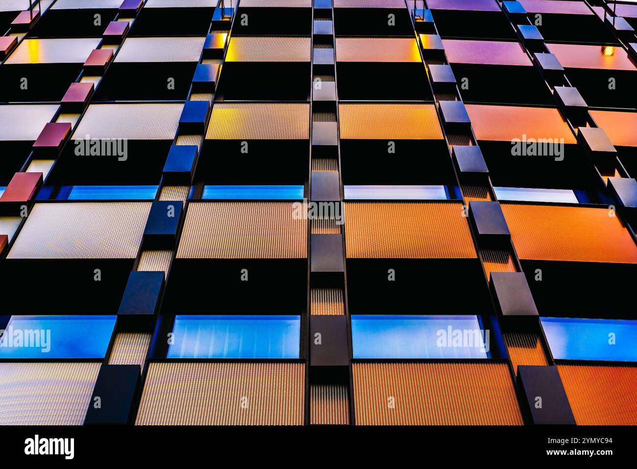 Modern Multicolored Architectural Facade with Repetitive Geometric Patterns Stock Photo