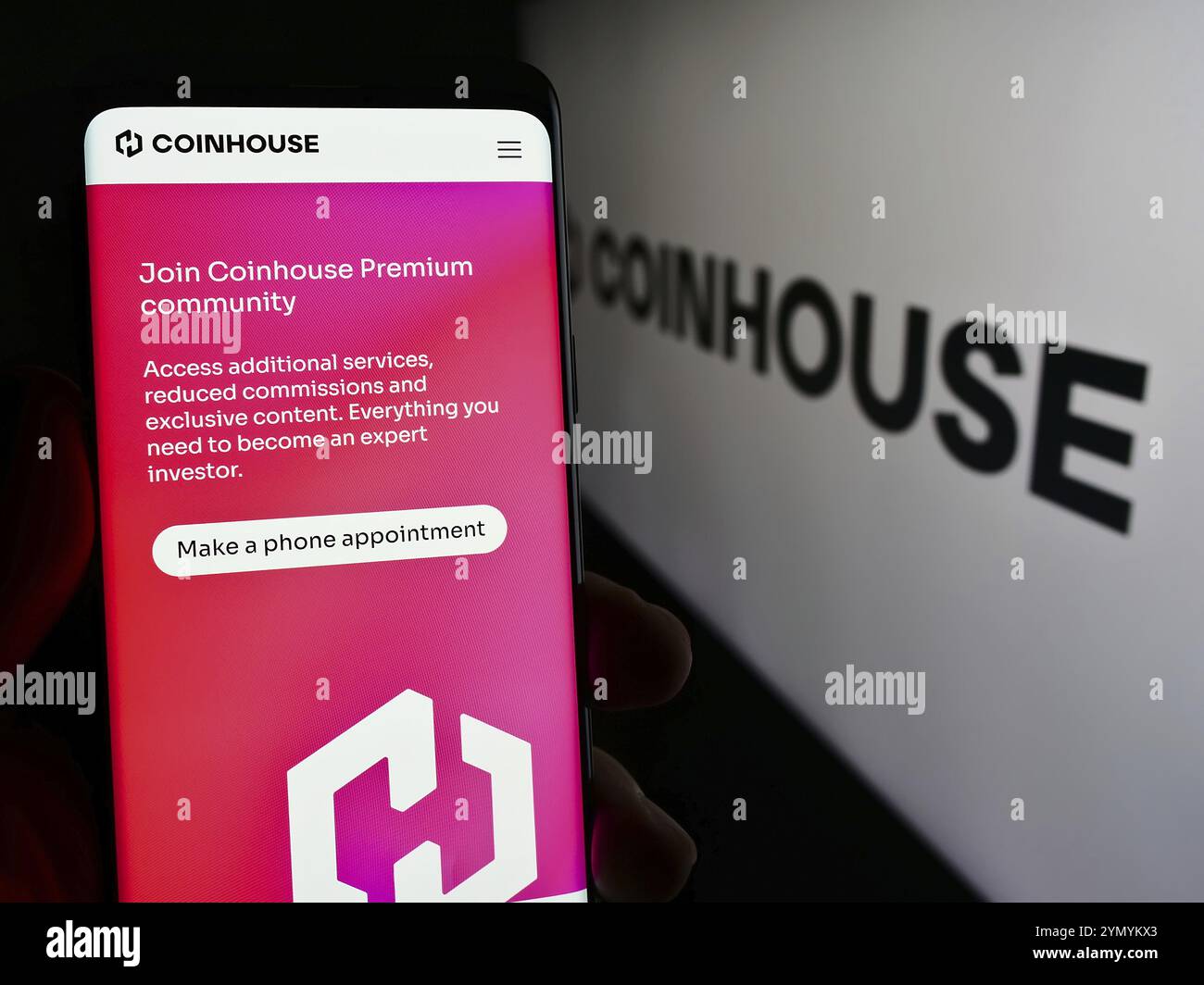 Smartphone with logo of French crypto investment company Coinhouse SAS in  front of business website. Focus on left of phone display Stock Photo -  Alamy