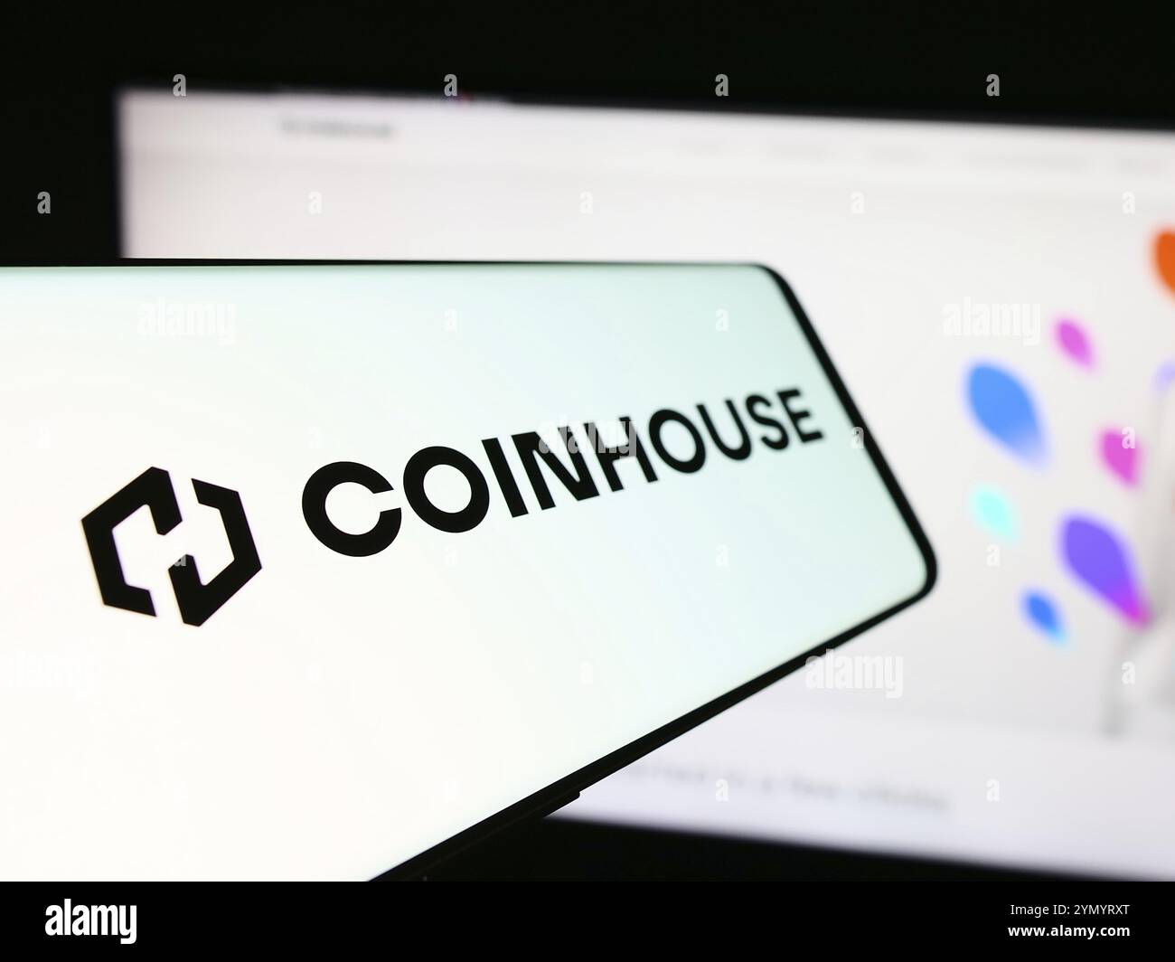 Smartphone with logo of French crypto investment company Coinhouse SAS in  front of business website. Focus on left of phone display Stock Photo -  Alamy