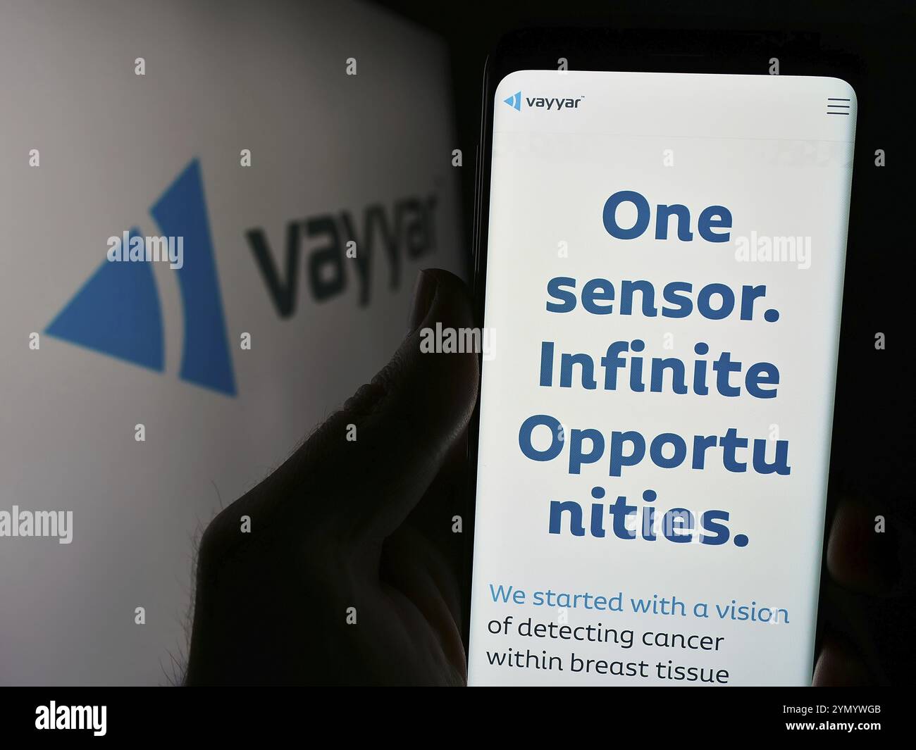 Stuttgart, Germany, 03-27-2024: Person holding cellphone with website of Israeli semiconductor company Vayyar Imaging Ltd. in front of logo. Focus on Stock Photo