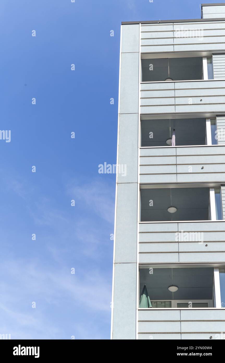 Building In The Sun Facade of a modern building in the sun with blue sky Stock Photo - Alamy