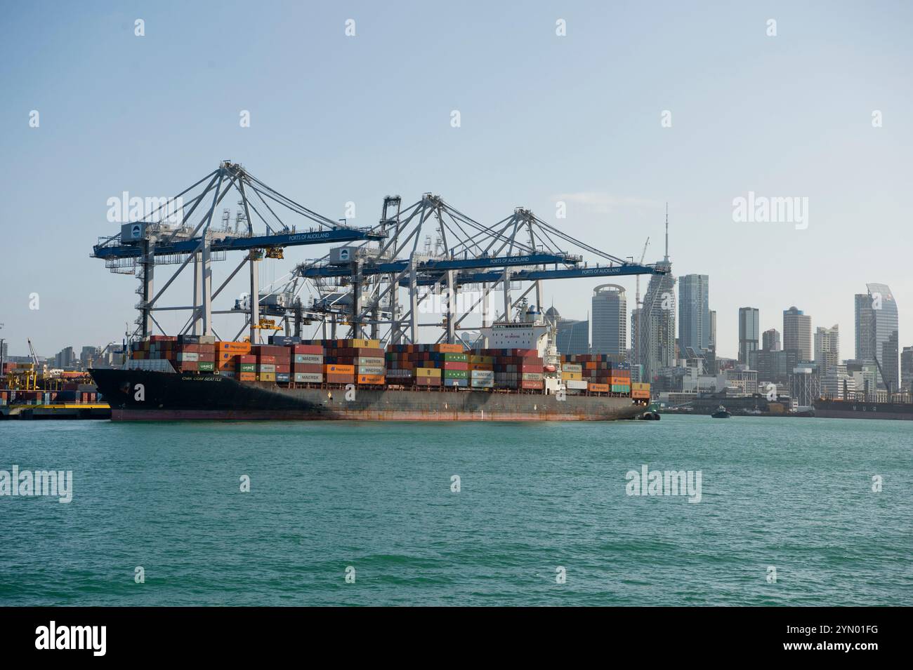 Container ship being loaded (or unloaded) in Auckland New Zealand Stock Photo