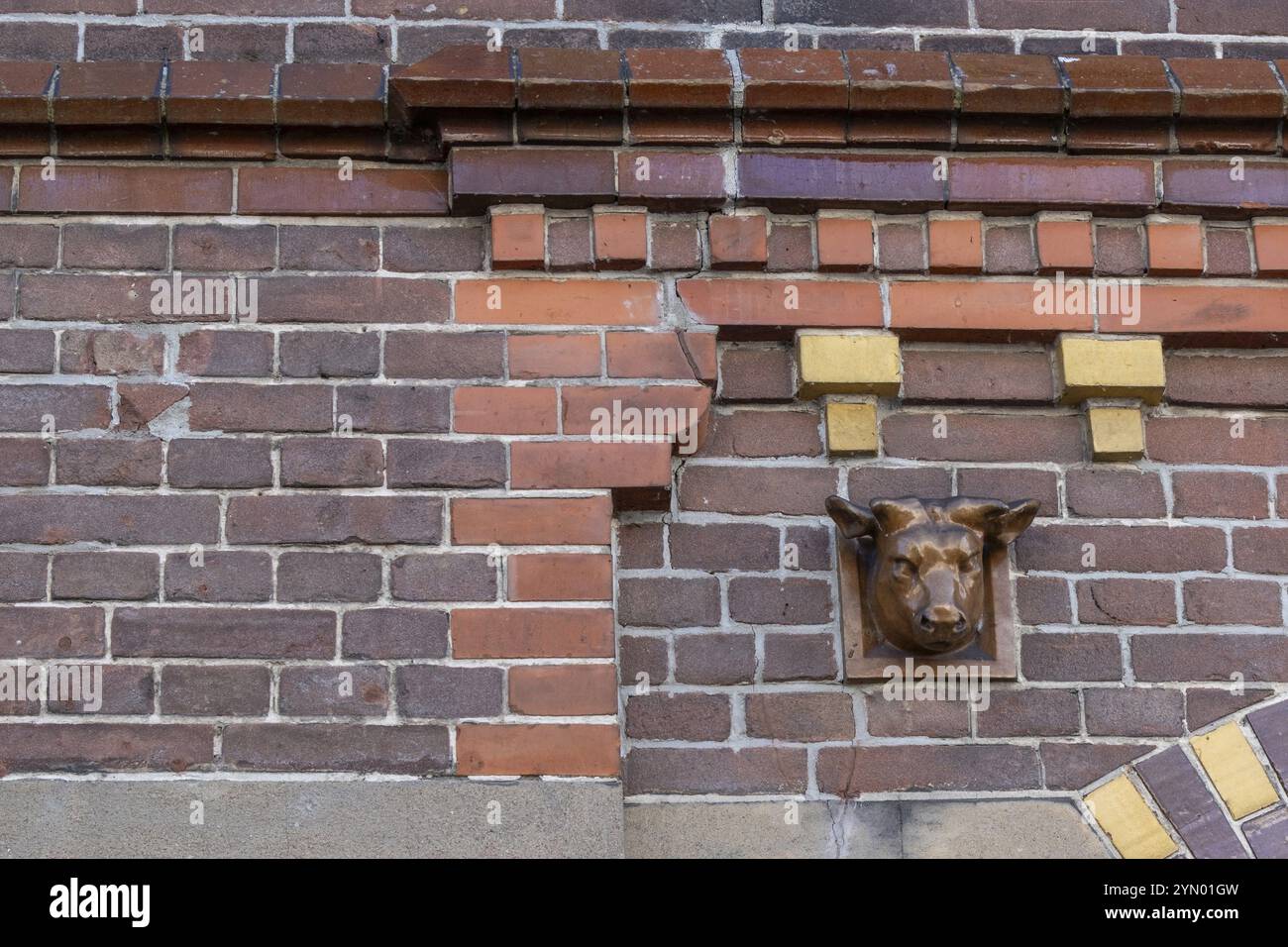 Brick facade with dentils and ox head Stock Photo