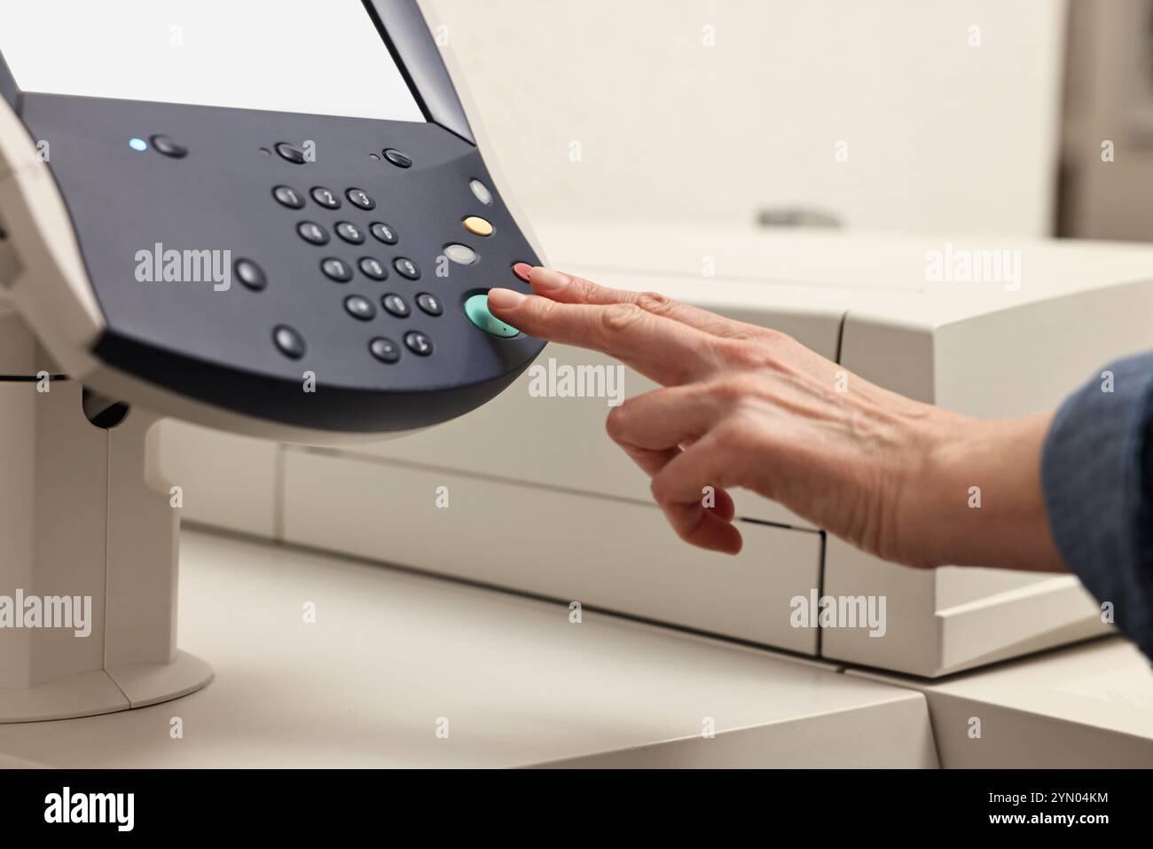 Woman using modern printer indoors, closeup. Printing house Stock Photo ...