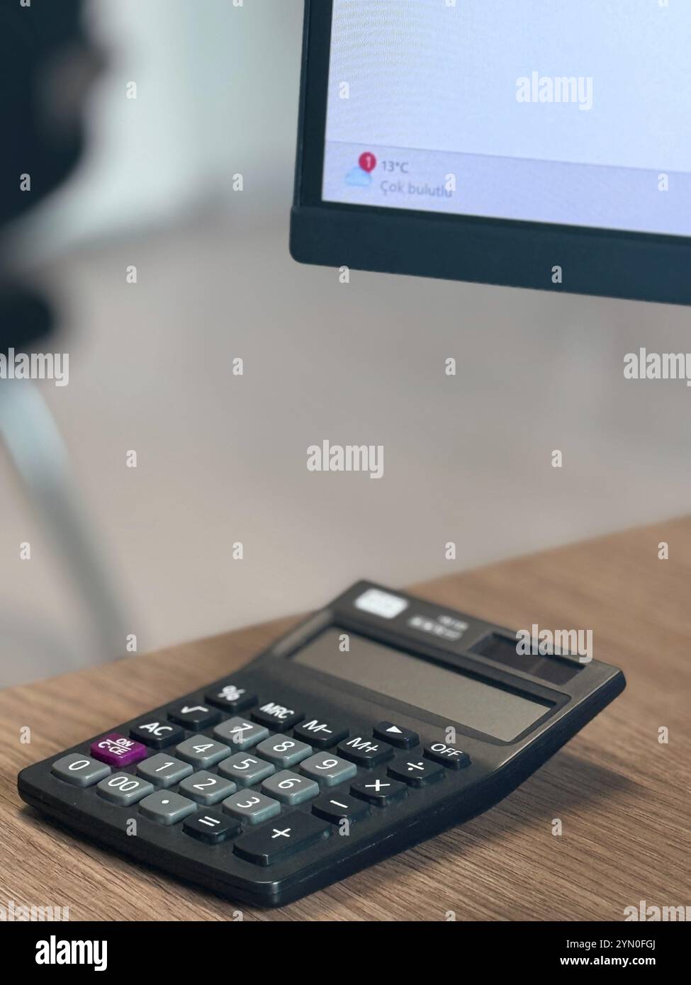 Calculating on calculator hi-res stock photography and images - Alamy