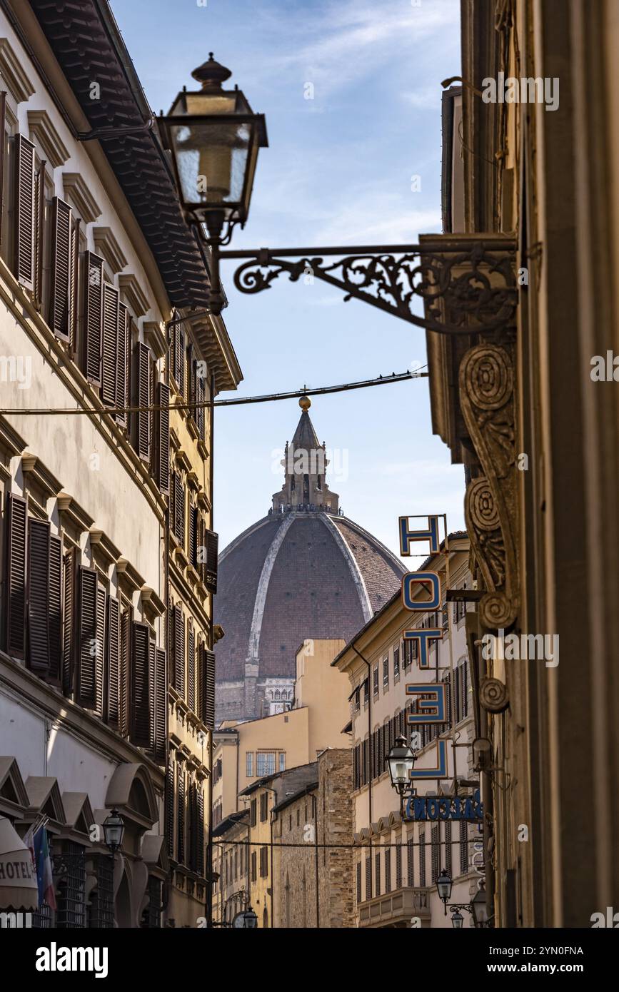 Cupola of the cathedral Santa Maria del Fiore in Florence, seen from a street far away, Italy, Europe Stock Photo