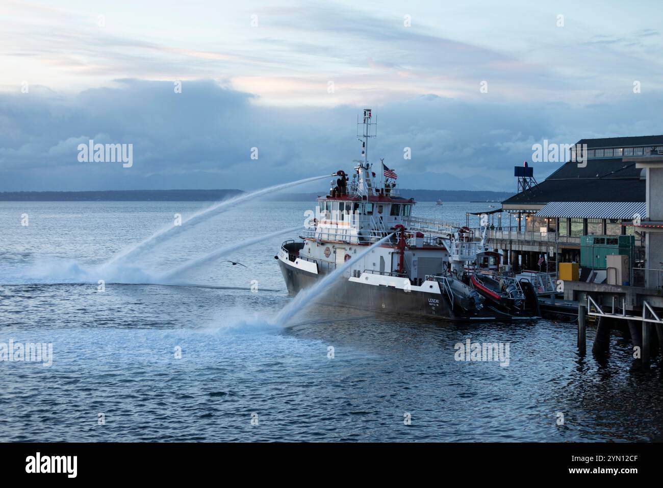 Fire Boat “Leschi” at Fire Station 5 pumps water into Elliott Bay along the Seattle Waterfront on Saturday, November 23, 2024. Stock Photo