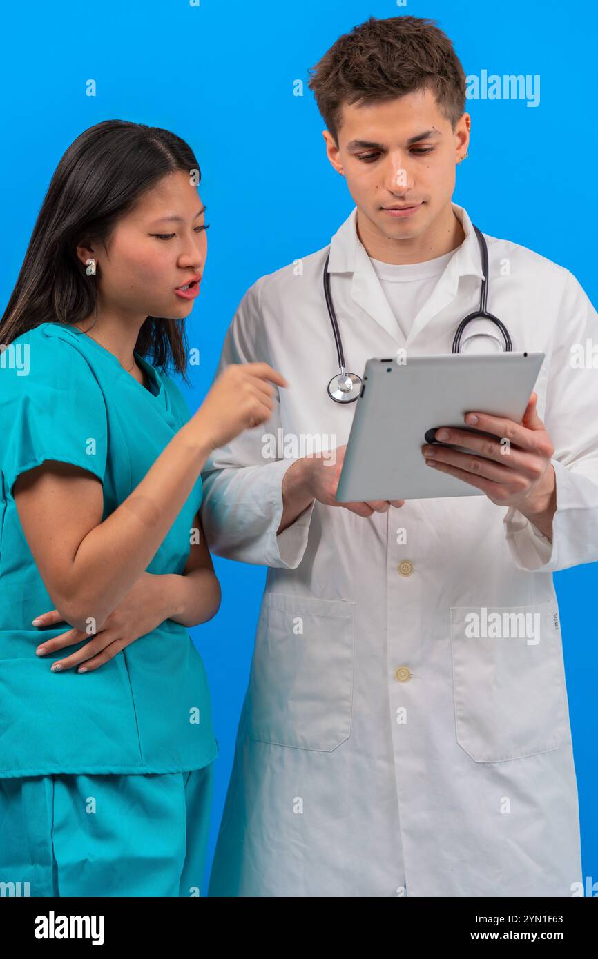 Healthcare professionals with patient hi-res stock photography and ...