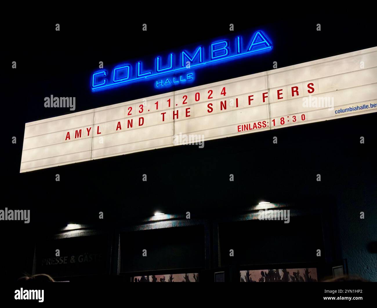 The billboard of the venue Columbiahalle in Berlin advertising a concert of the punk band Amyl and the Sniffers, Berlin, Germany - Smartphone Captured Stock Image