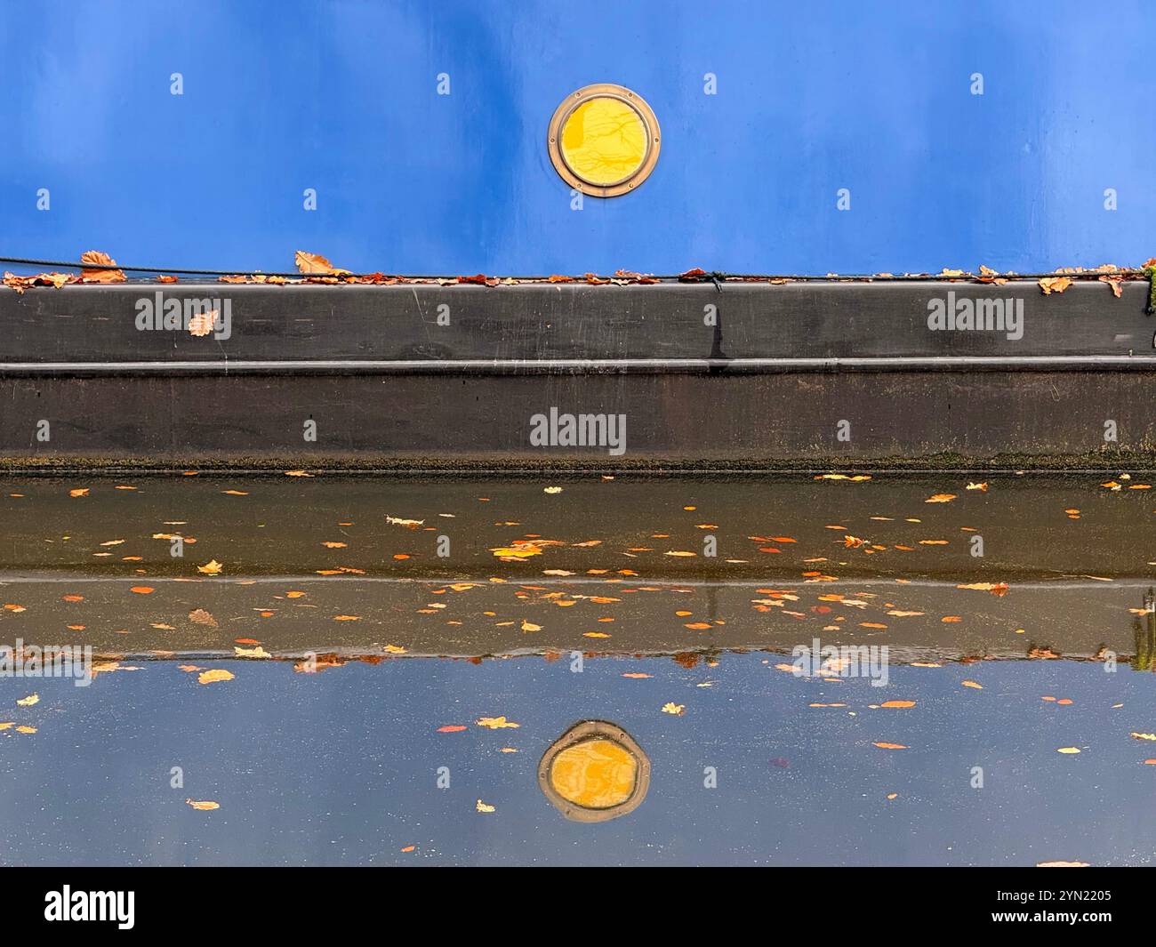 Detail of Narrow boat reflected in water on Leeds and Liverpool canal at Adlington near Chorley, Lancashire UK - Smartphone Captured Stock Image