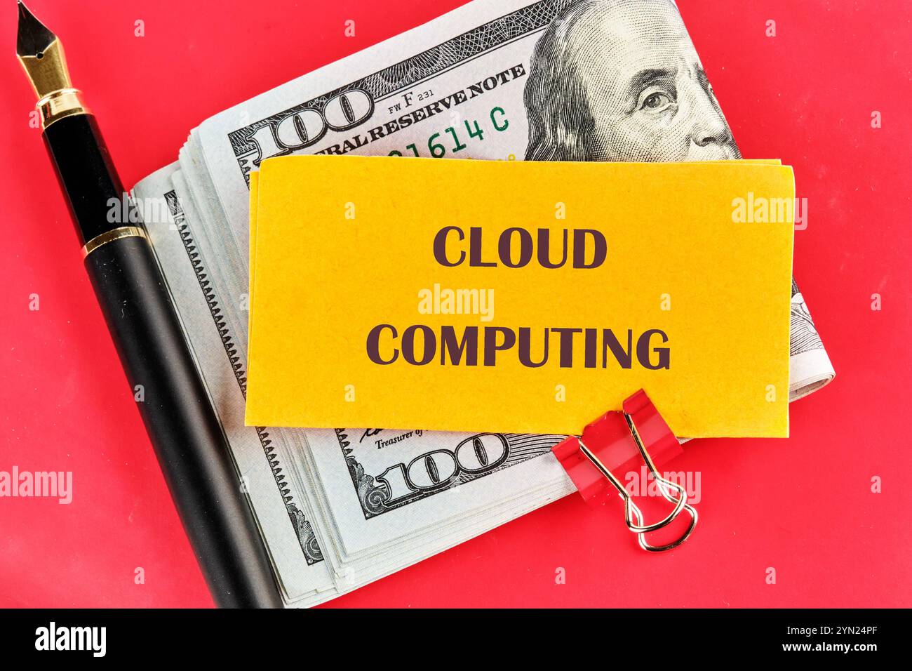 The concept of technology and development. Phrase, words, text CLOUD COMPUTING on a yellow sticker folded in half Stock Photo