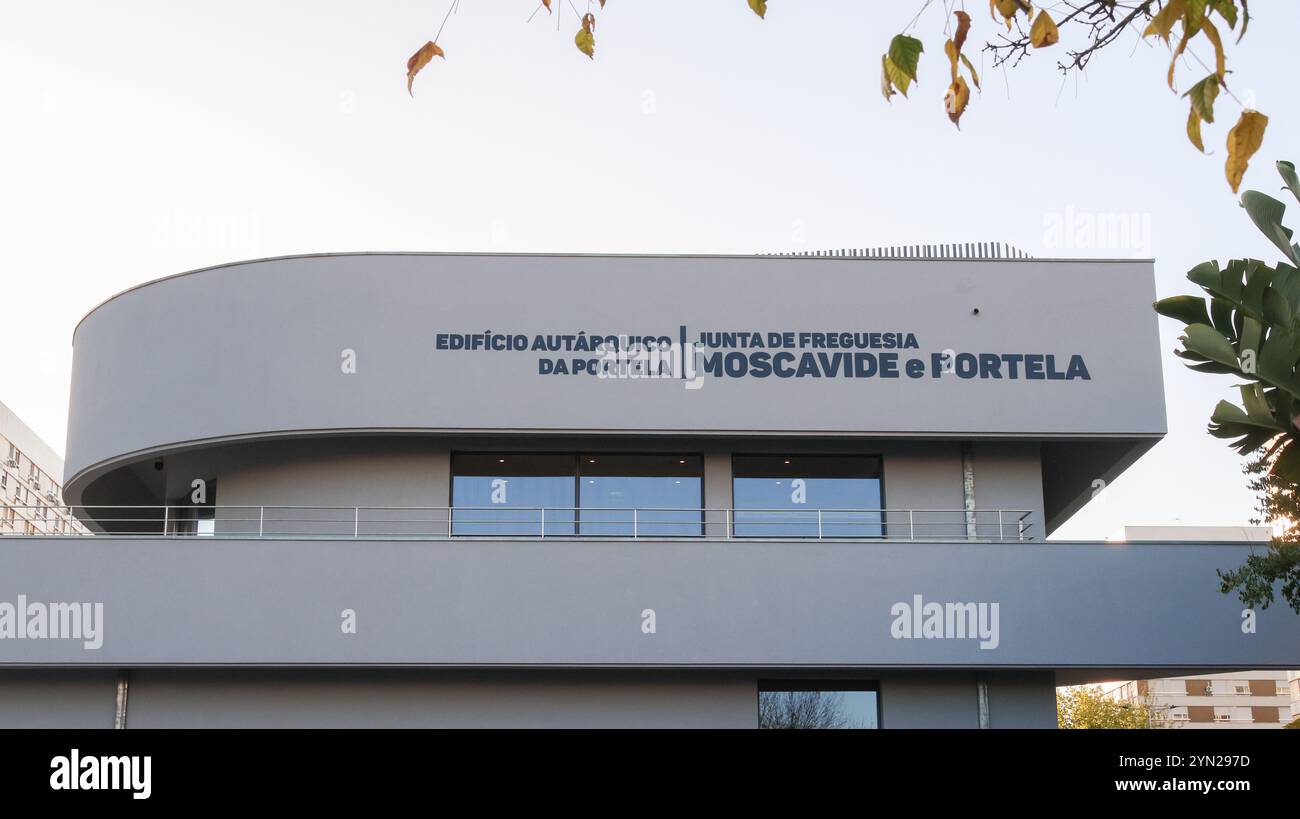 Modern building of the moscavide and portela parish council in lisbon, portugal, featuring a curved facade and large windows Stock Photo