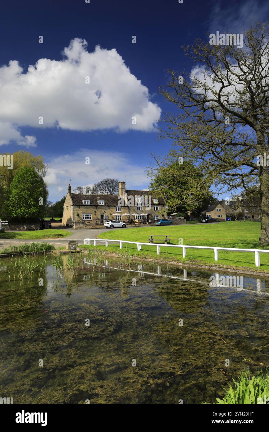Summer colours over the village green and pond at Barrowden village ...