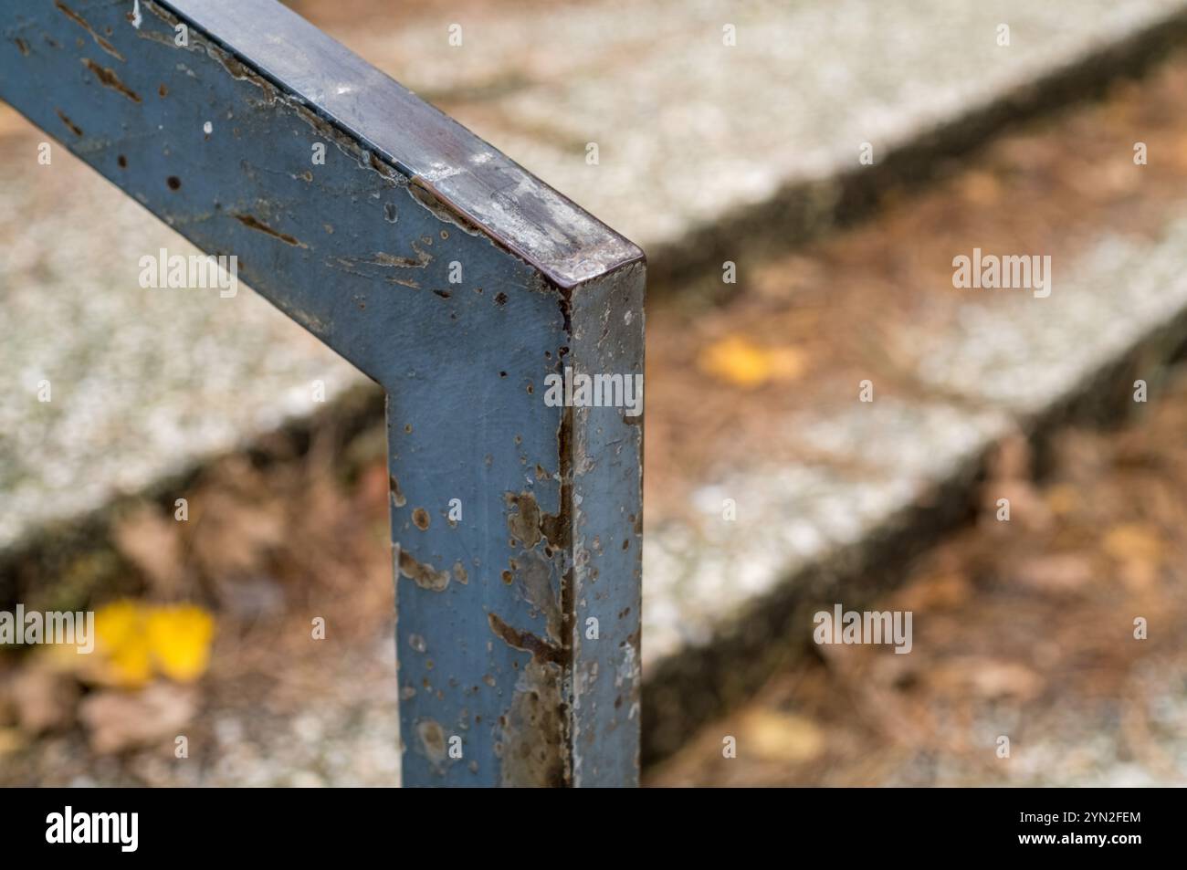 Weathered metal railing showing rust, decay, and peeling paint with ...