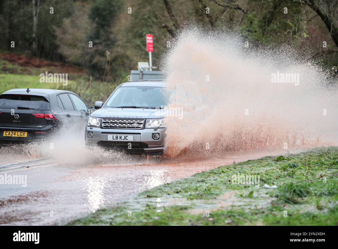 Kidderminster, Worcestershire, UK. 24th Nov, 2024. UK Weather: Vehicles encounter hazardous driving conditions on the A442 near Kidderminster, Worcestershire, as rainwater run-off creates spectacular puddles. Credit: Peter Lopeman/Alamy Live News Stock Photo