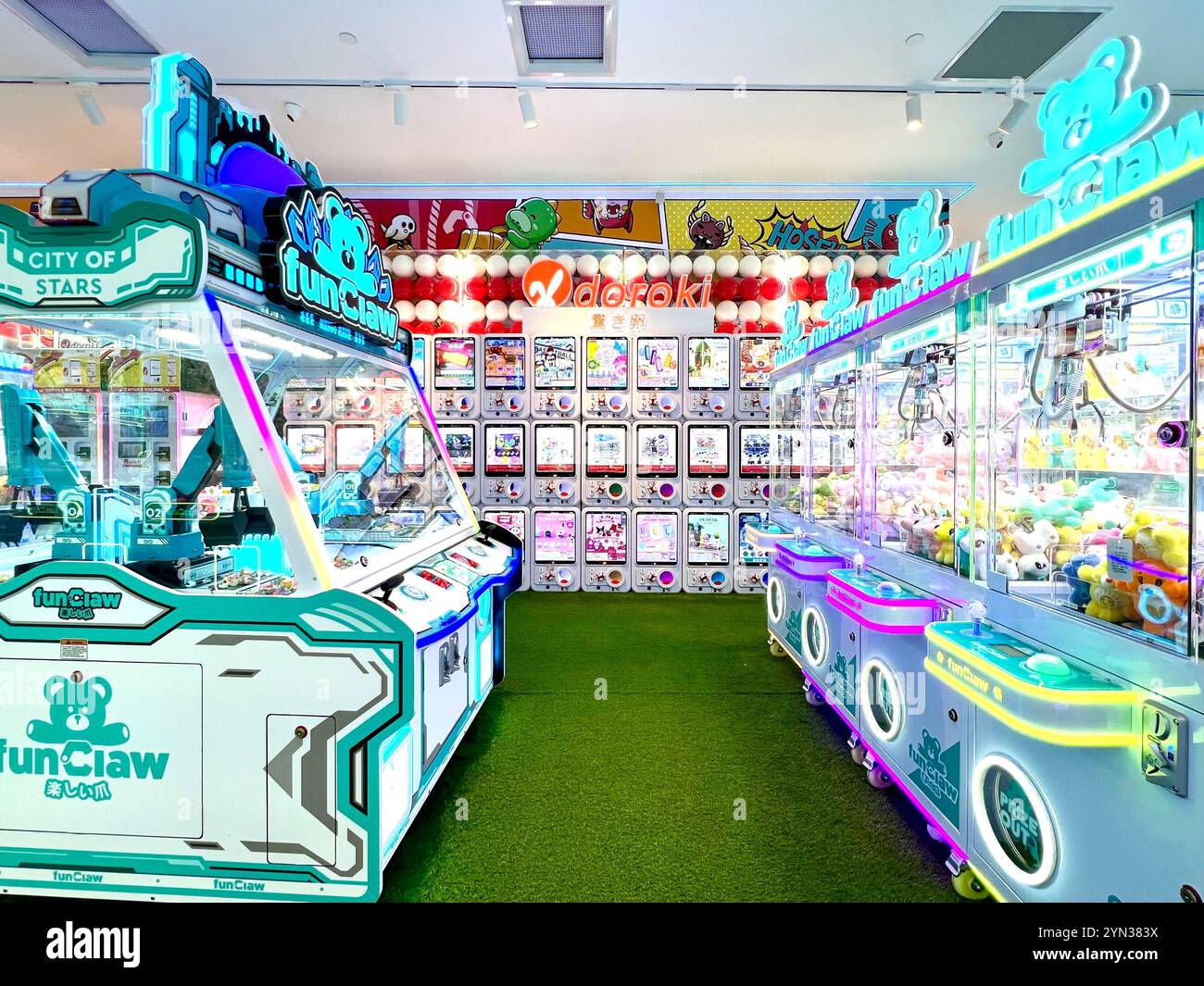 Well-lit claw machinese filled with plenty of plushie for users to experience arcade game. Singapore. - Smartphone Captured Stock Image