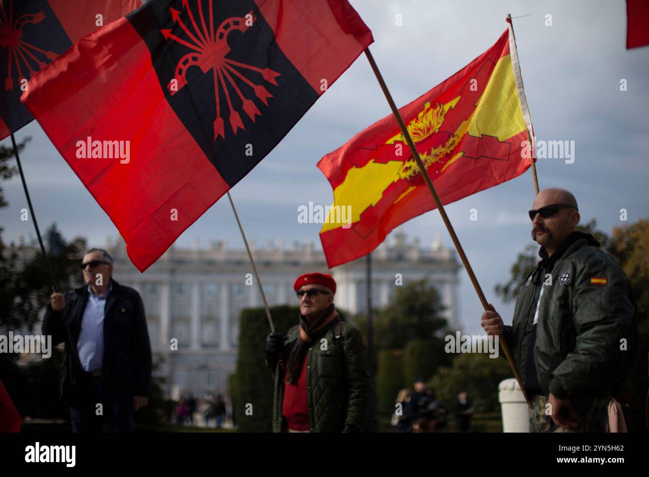 Madrid, Spain. 24th Nov, 2024. Supporters hold Falangist flags, during a rally commemorating the anniversary of the death of dictator Francisco Franco on November 20, 1975 and of José Antonio Primo de Rivera on November 20, 1936, founder of the right-wing group Falange Española, in the Plaza de Oriente, in Madrid. Credit: SOPA Images Limited/Alamy Live News Stock Photo