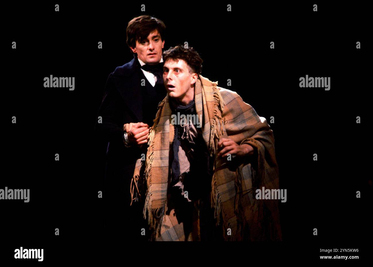 l-r: Roger Rees (Nicholas Nickleby), David Threlfall (Smike) in NICHOLAS NICKLEBY at the Royal Shakespeare Company (RSC), Aldwych Theatre, London WC2  19-20/06/1980  adapted by David Edgar from the novel by Charles Dickens  music and lyrics: Stephen Oliver  design: John Napier & Dermot Hayes  lighting: David Hersey  directors: Trevor Nunn & John Caird Stock Photo