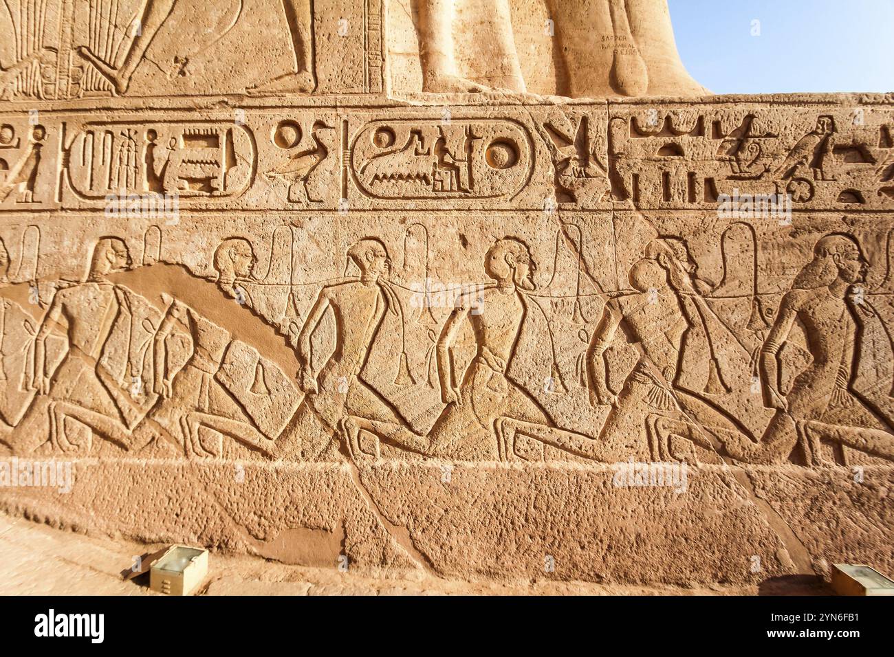 Egyptian relief of defeated and enslaved enemies at the temple of Abu Simbel, Egypt, Africa Stock Photo