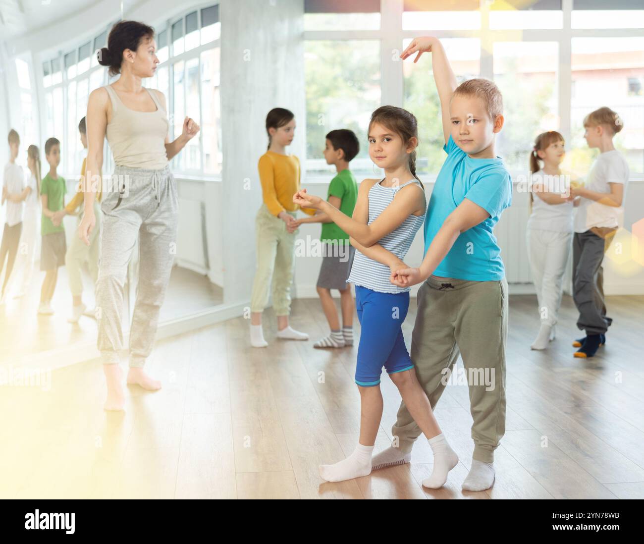 Girl paired up with boy and training to perform slow couple dance ...