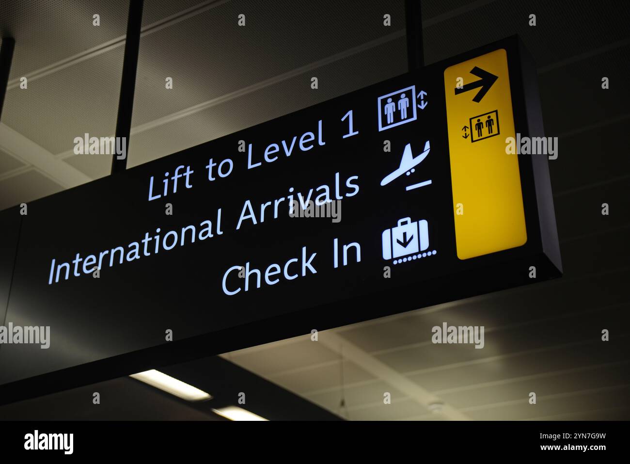Aircraft Check In Airport signage for lifts, check in and international arrivals Stock ...
