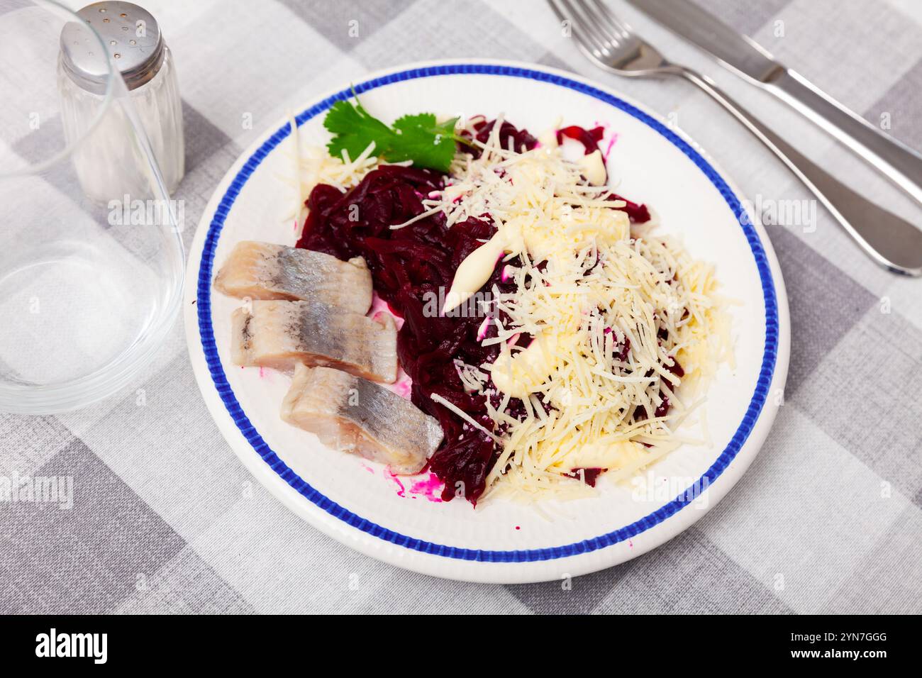 Beetroot served with cheese and pickled mackerel Stock Photo