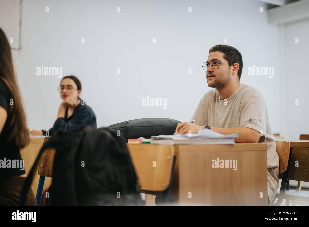 High school students attentively participating in a classroom session Stock Photo