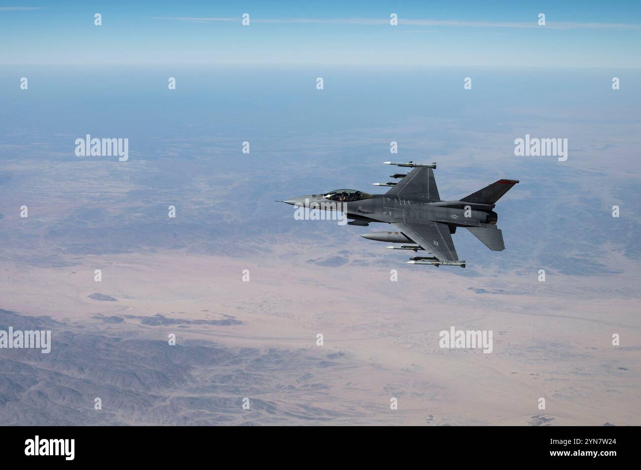 A U.S. Air Force F-16 Fighting Falcon flies over the U.S. Central Command area of responsibility Nov. 20, 2024. Fighting Falcons and other combat aircraft deployed to the region conduct regular patrols to deter aggression and defend U.S. forces, allies and partners. (U.S. Air Force photo) Stock Photo