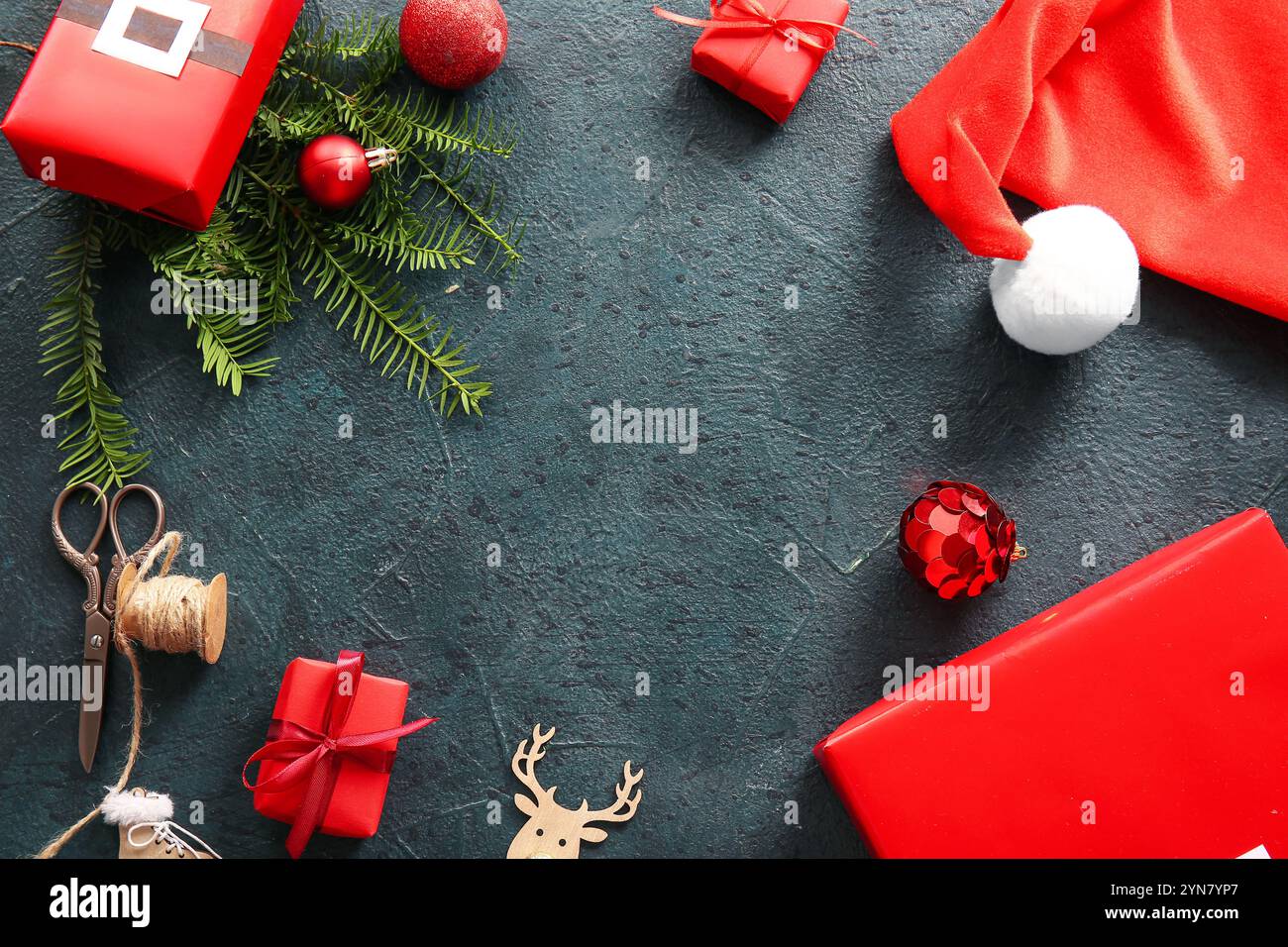 Frame made of gift boxes, Christmas toys and fir branches on dark ...