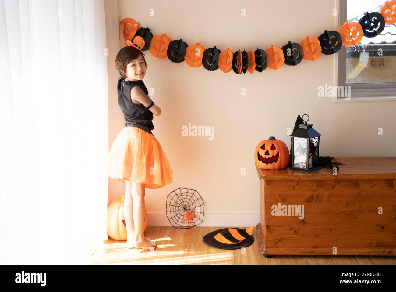 Girl wearing Halloween costume and decorations Stock Photo - Alamy