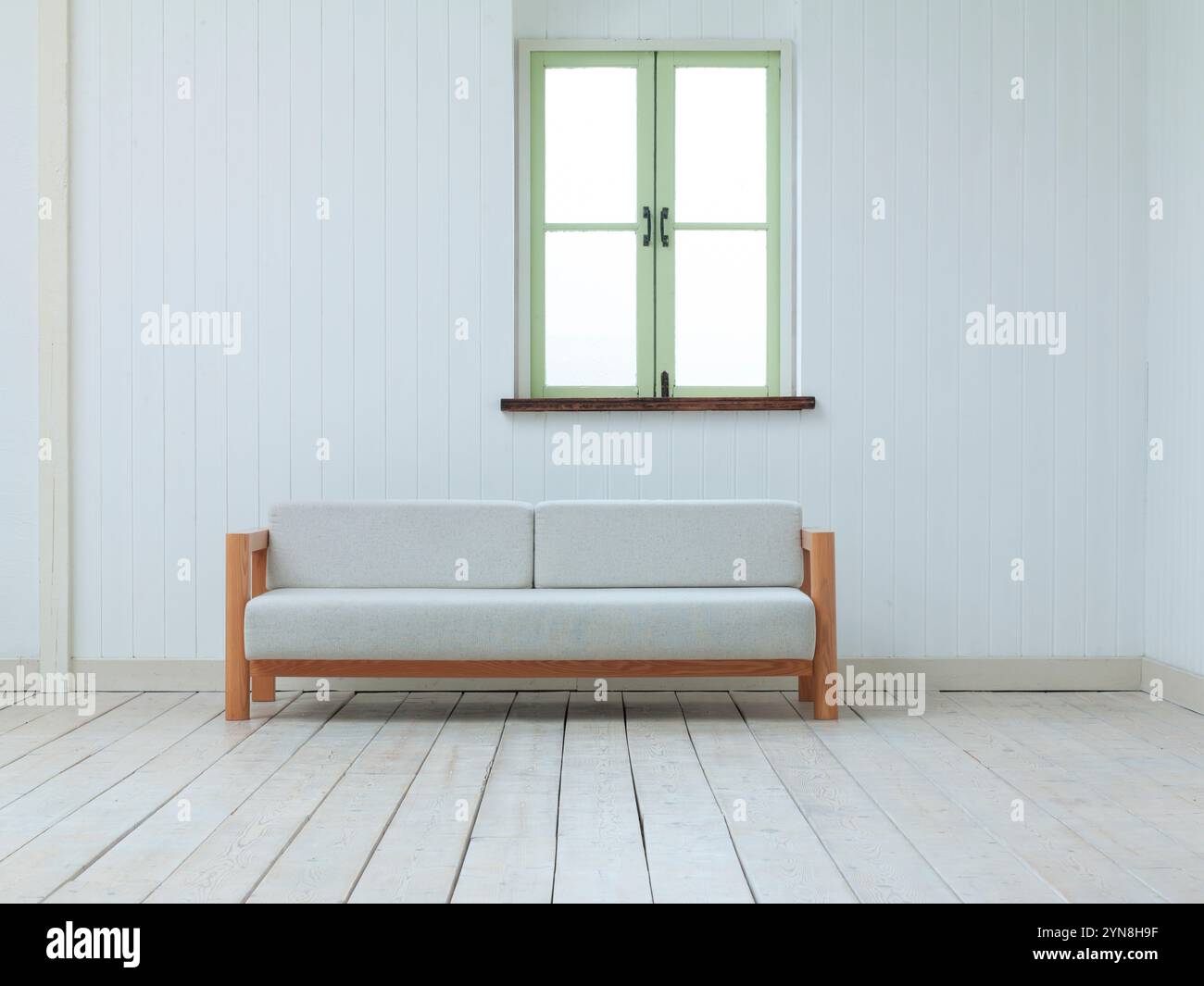 Sofa in room with window Stock Photo
