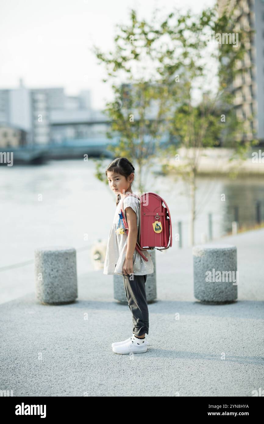 Girl carrying school bag hi res stock photography and images Alamy