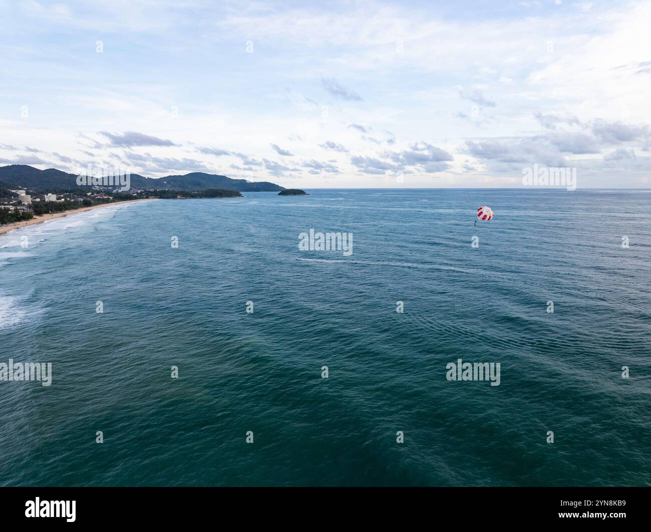 Aerial view of a blue sea surface water texture background and sun ...