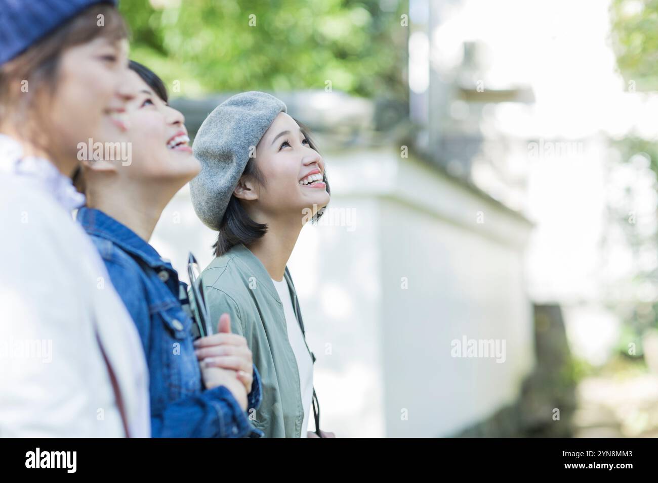 Three women look hi-res stock photography and images - Alamy