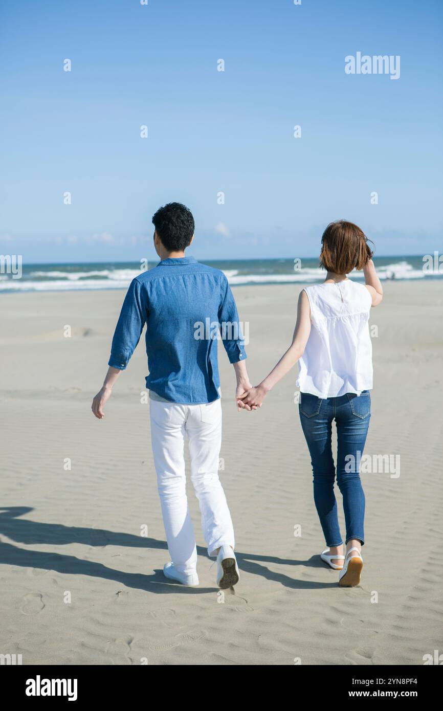 Back view handsome couple walking hi-res stock photography and images ...