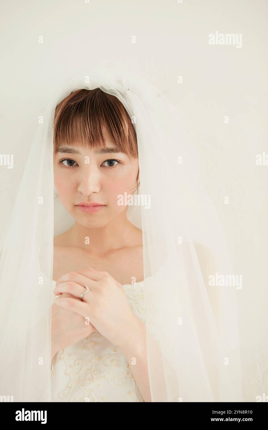 Hands over her chest hi-res stock photography and images - Alamy