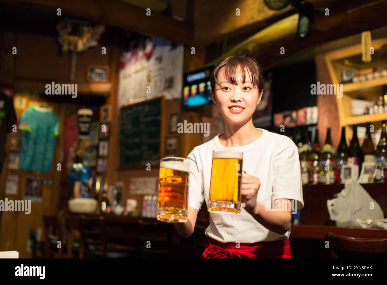 Woman carrying beer hi-res stock photography and images - Alamy