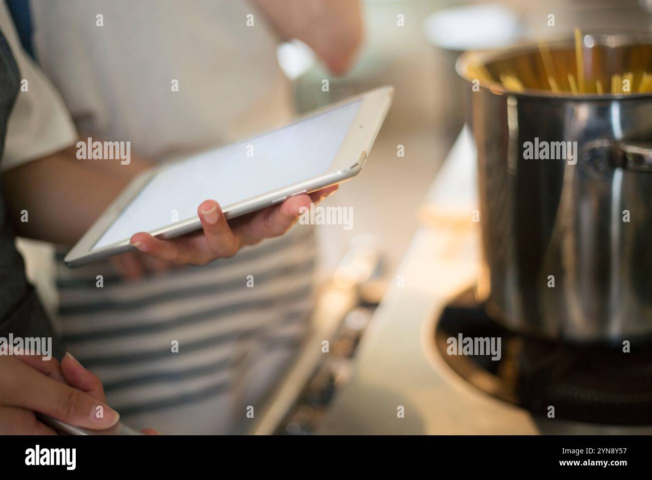 Someone Using Something This is a woman eating something hi-res stock photography and images ...