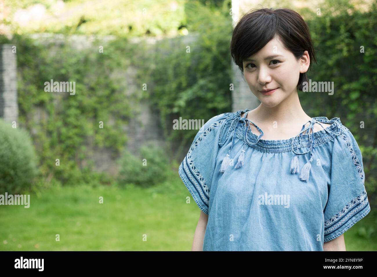 Woman short hair standing outdoors hi-res stock photography and images ...