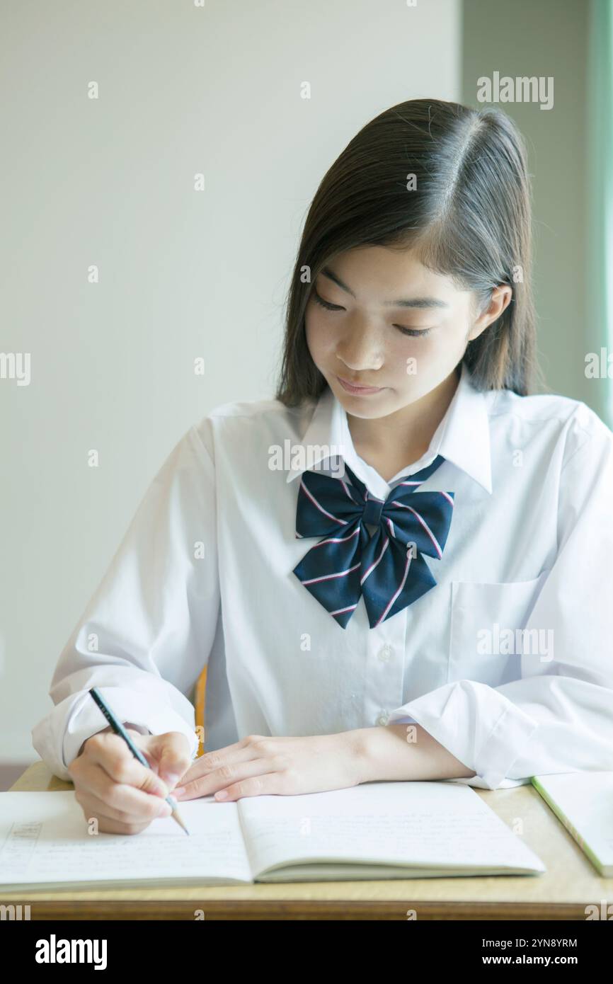 High school girls studying in a classroom Stock Photo - Alamy