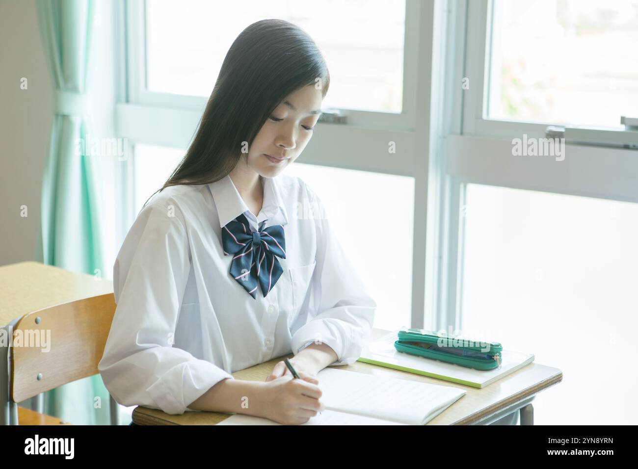High school girls studying in a classroom Stock Photo - Alamy