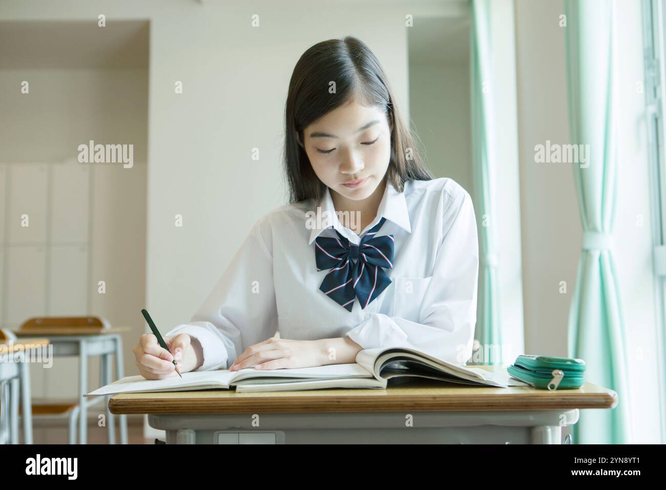 High school girls studying in a classroom Stock Photo - Alamy